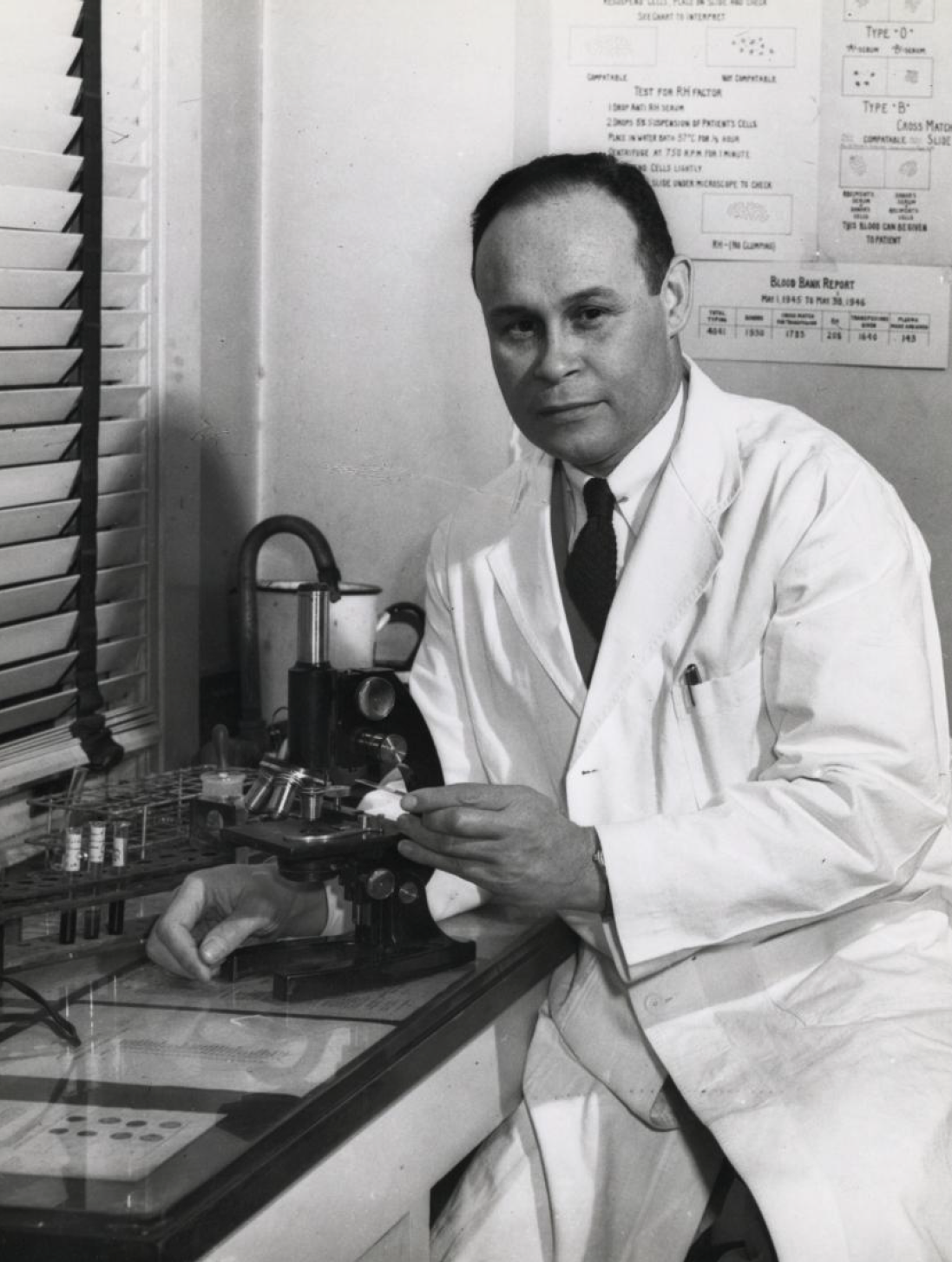 Portrait of Charles Drew in a laboratory wearing a lab coat.